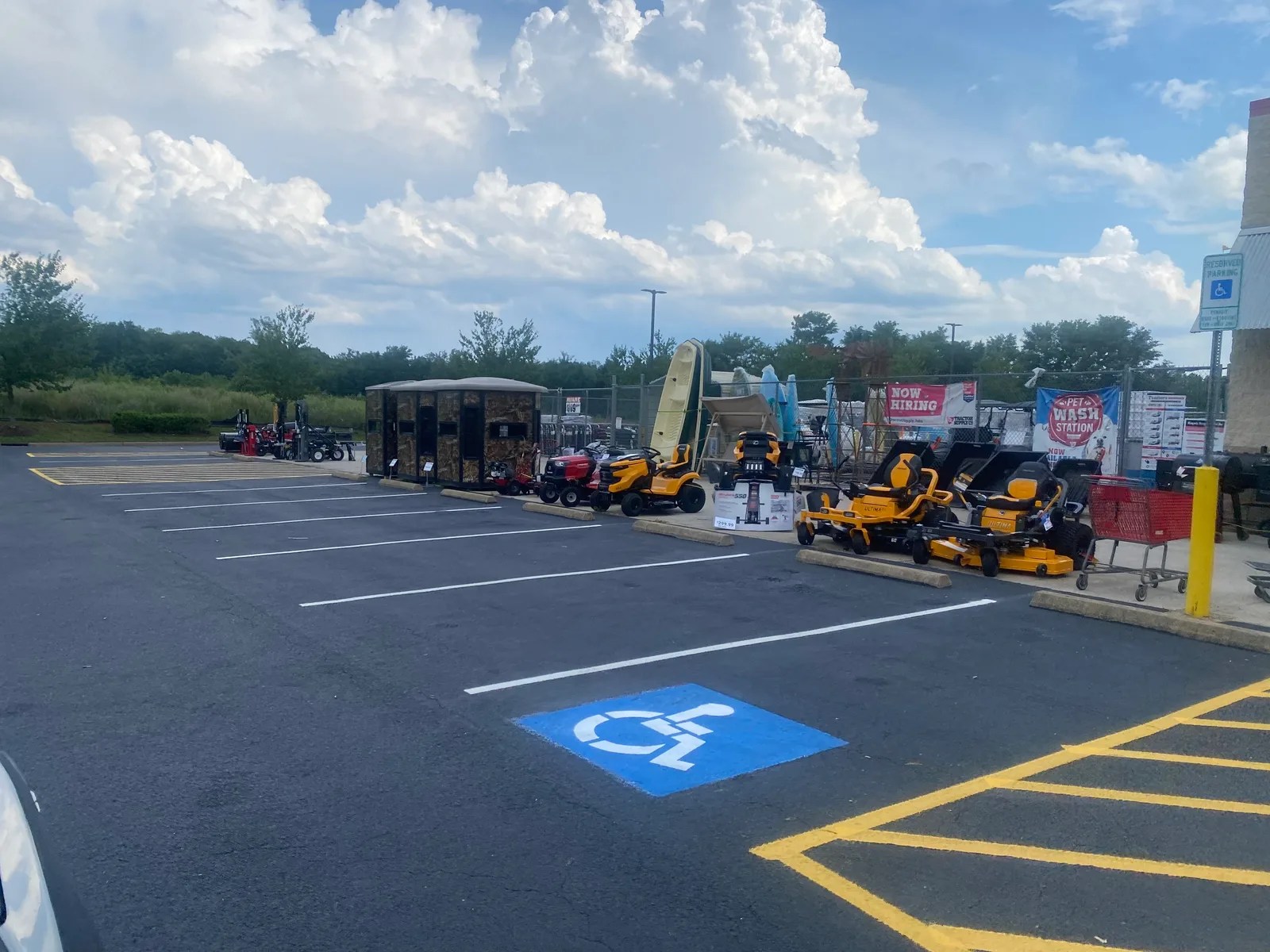 Freshly striped Tractor Supply parking lot with new ADA symbol and crosshatch